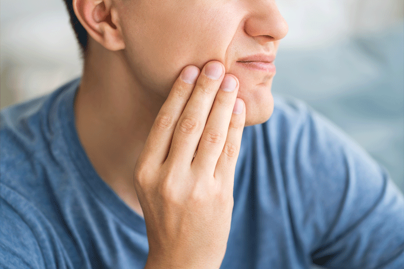 A man with toothache, periodontal disease in wisdom teeth.